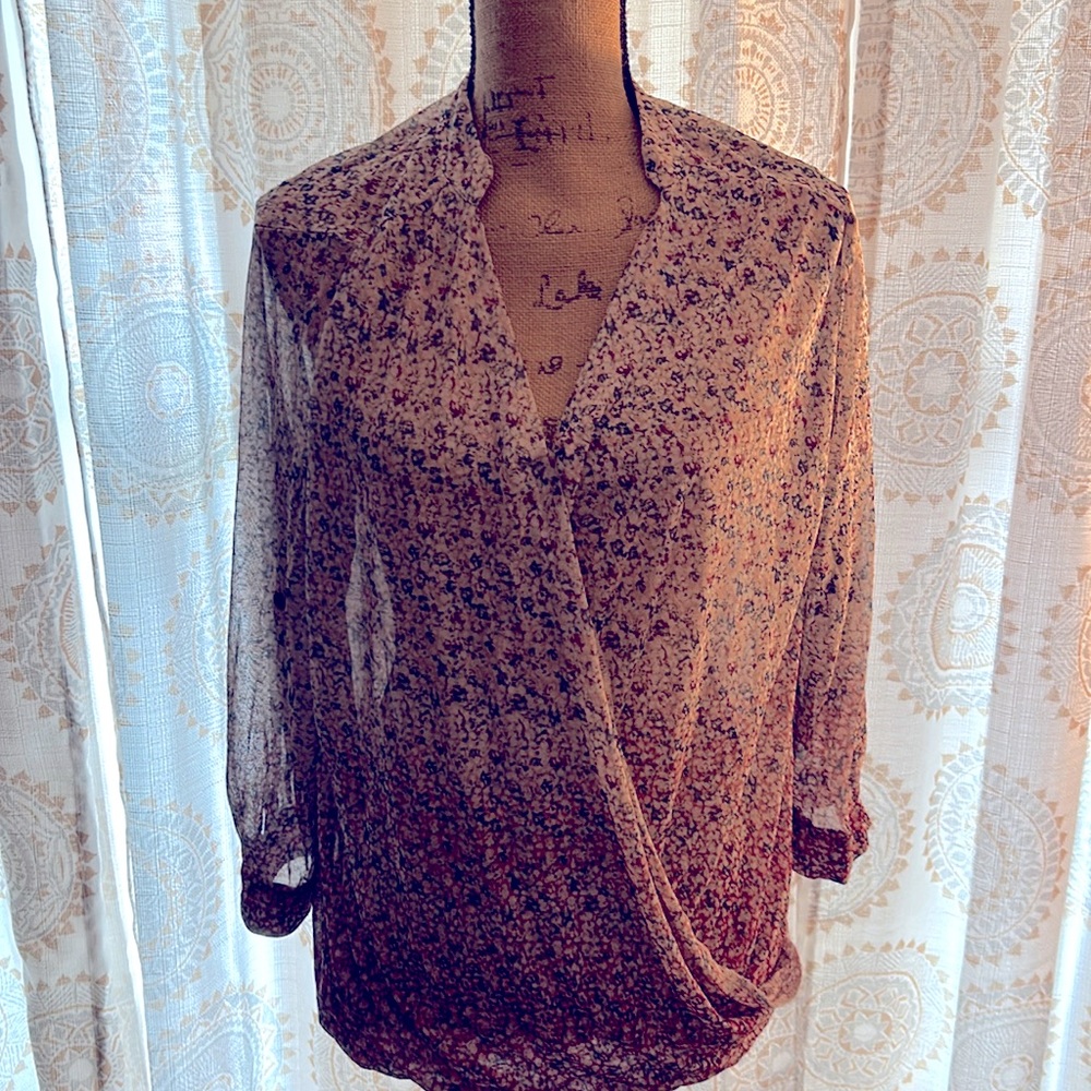 Large, sheer three-quarter sleeves blouse